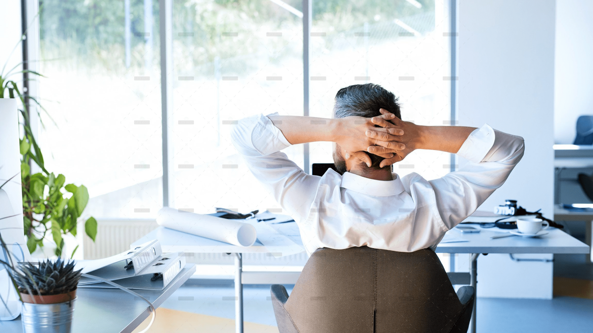 demo-attachment-477-Businessman-at-the-desk-in-his-office-resting.